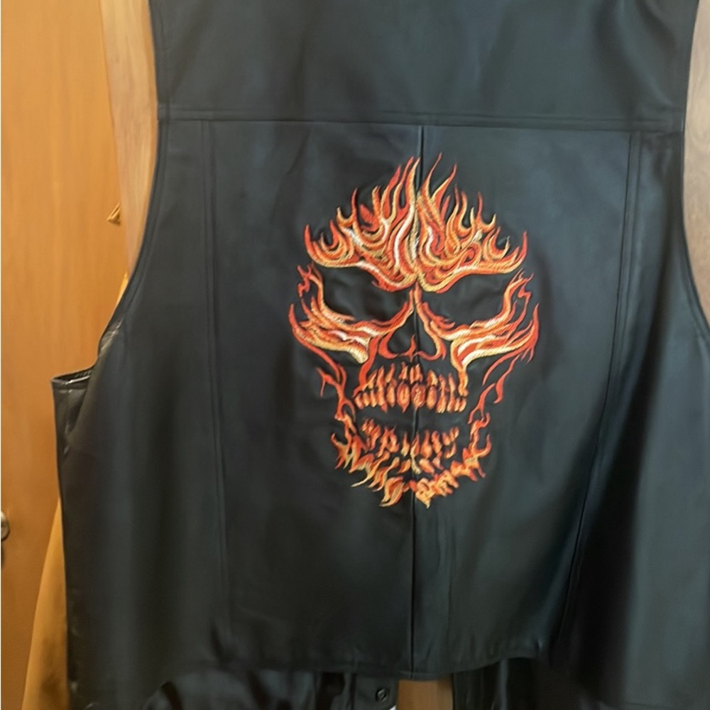 Leather vest never used , size says 5xl but fits more like a big 2xl or a 3xl